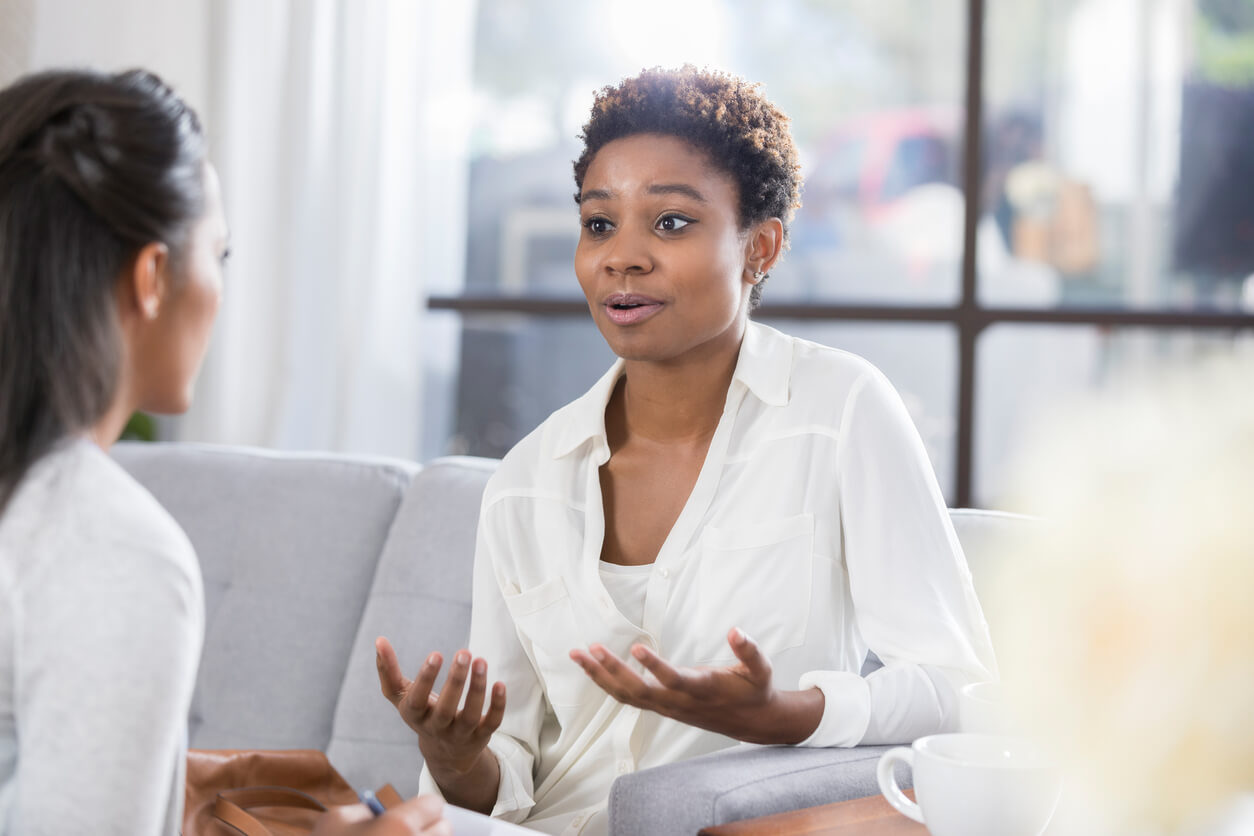 photo of black woman in conversation