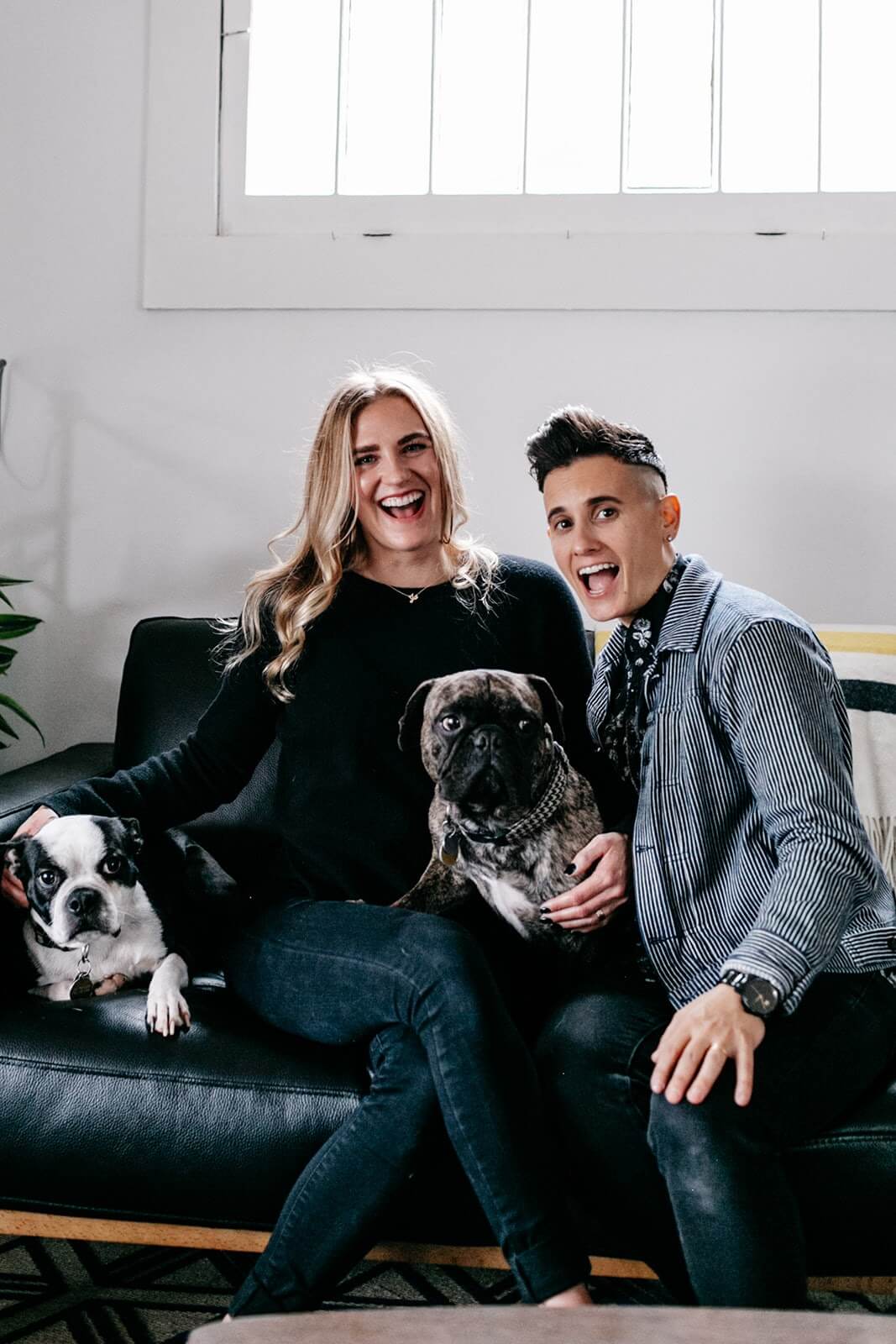 couple with dogs on a couch