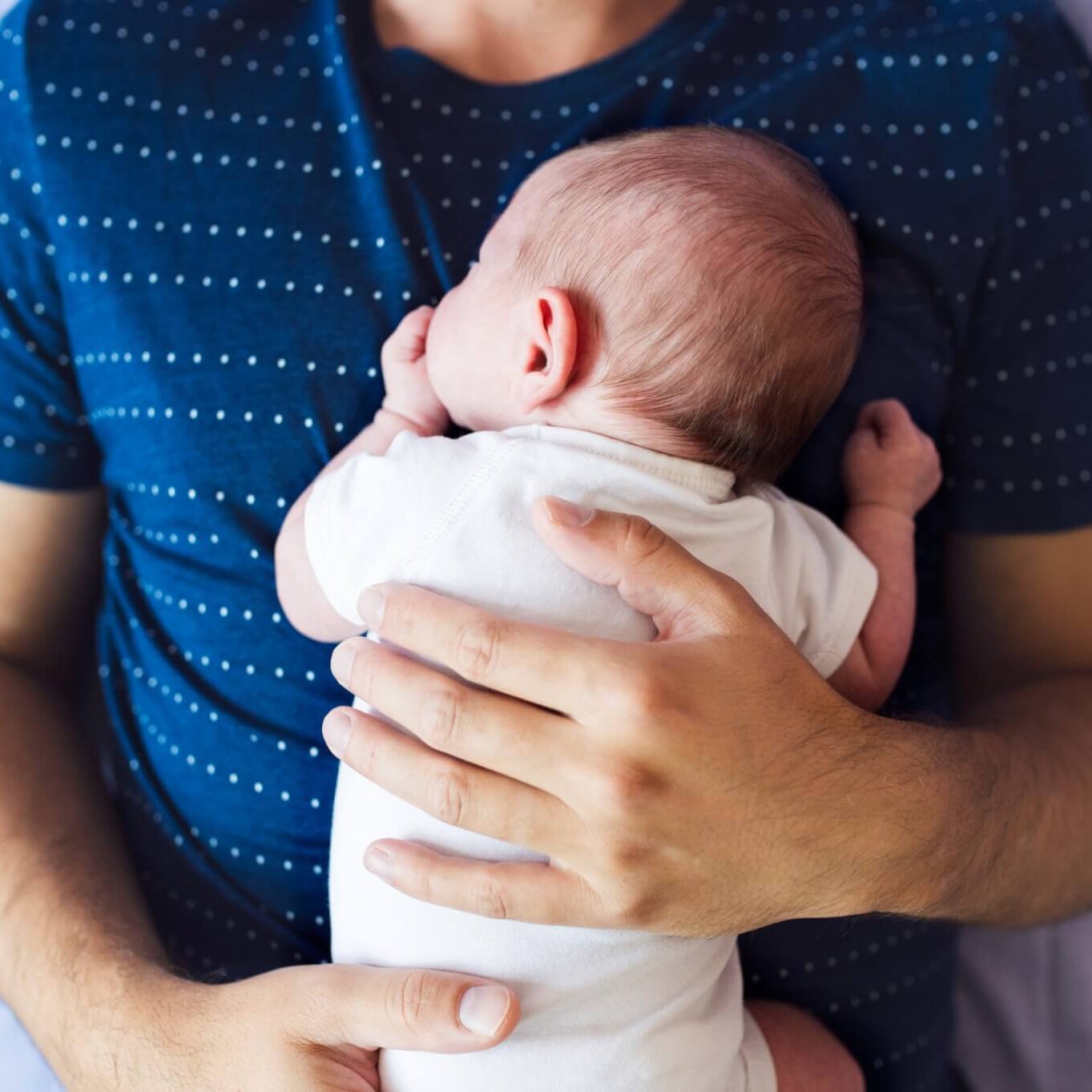 photo of baby laying on chest