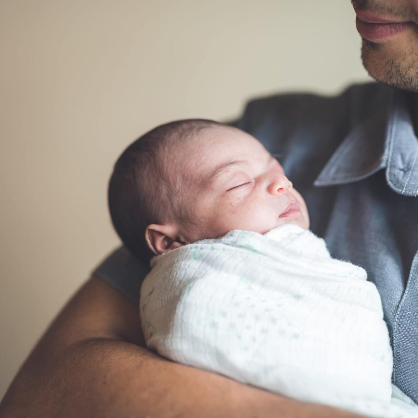 New Dad Holding Infant Daughter